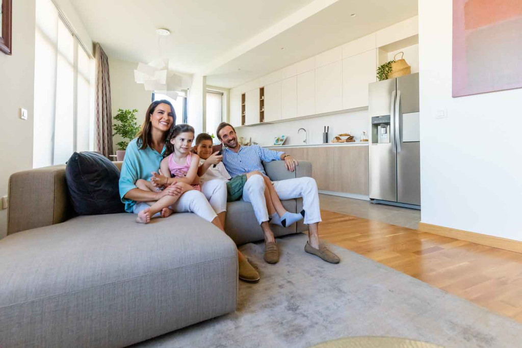 a happy familly in their apartment