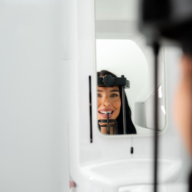 A girl has her teeth scanned at the Rendgen centar in Belgrade Waterfront.